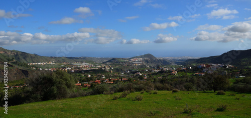 Beautiful landscape, green prairie and blue sky with scattered clouds, Valsequillo village, Gran Canaria, Canary Islands