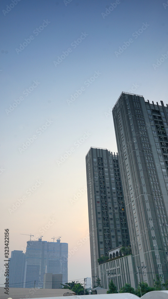 The tall building .background is sunset sky of city The tall building .background is sunset sky of city