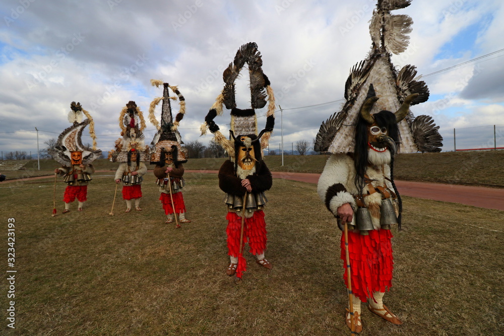 Elin Pelin, Bulgaria - February 15, 2020: Masquerade festival in Elin Pelin, Bulgaria. People with mask called Kukeri dance and perform to scare the evil spirits.