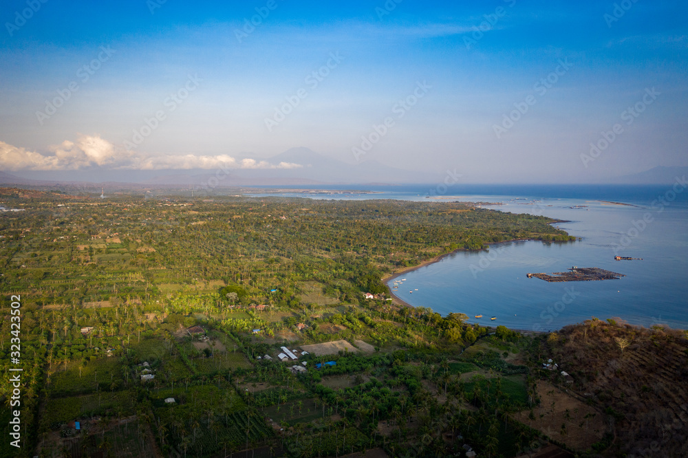 landscape of sea and fields