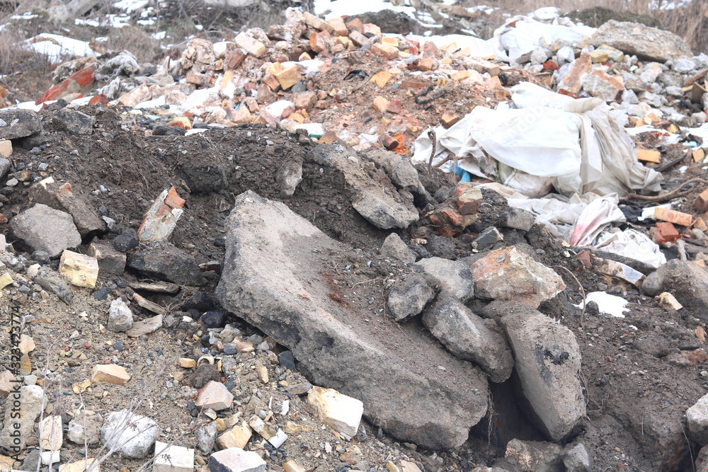 Construction waste with elements of various dismantled and destroyed old structures at municipal landfill Construction waste with elements of various dismantled and destroyed old structures at municipal landfill