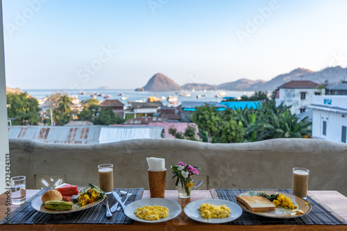 breakfast served in a restaurant with view on sea and mountains