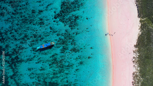 Photography aerial overhead shot of pink beach with crystal clear water in indonesia komodo