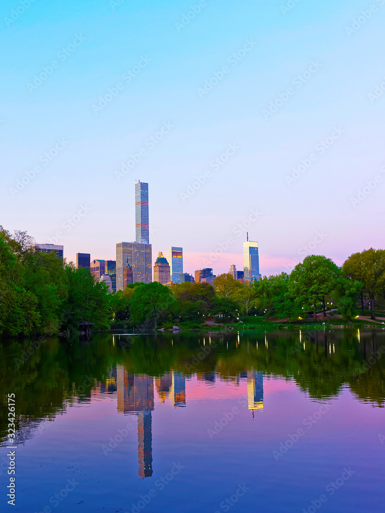 Manhattan skyline mirrored from water in Central Park reflex