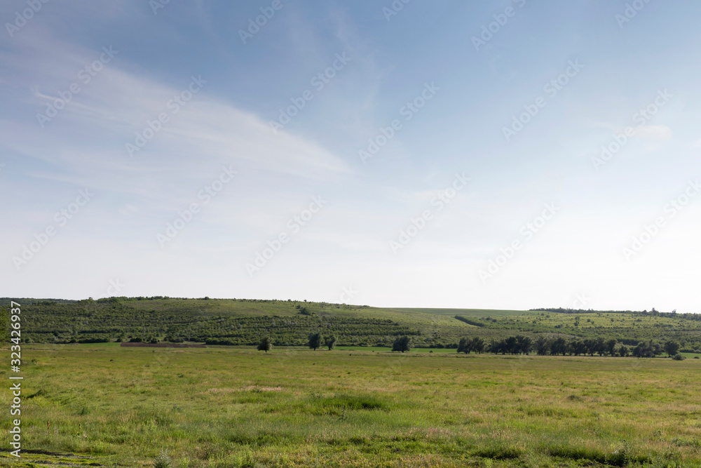 Beautiful rural landscape with nice fleecy clouds.