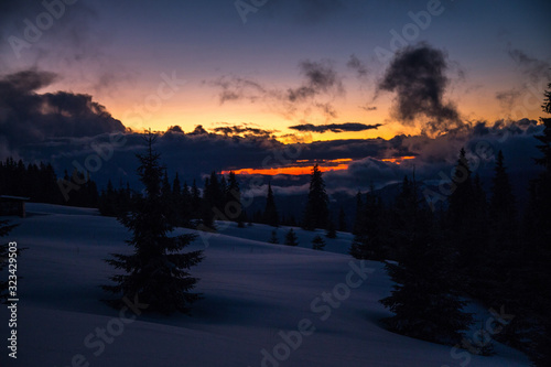 Winter landscape in the higest Carpahian mountains near Yaremche in the sunset photo