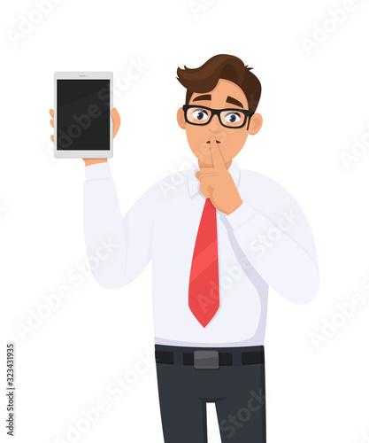 Businessman showing new tablet computer and asking silence. Shut up! Keep quiet! Person is keeping finger on lips. Male character illustration. Modern technology concept in vector cartoon style.