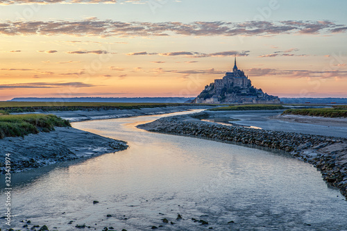 Mont-Saint-Michel is the name of a tidal island located off the coasts of Normandy and Brittany, near the mouths of the Couesnon