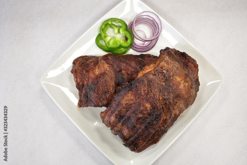 A Fresh Cooked Rack of Ribs on a Plate A Fresh Cooked Rack of Ribs on a Plate