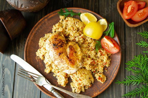 roasted chicken breast with couscous, top view image