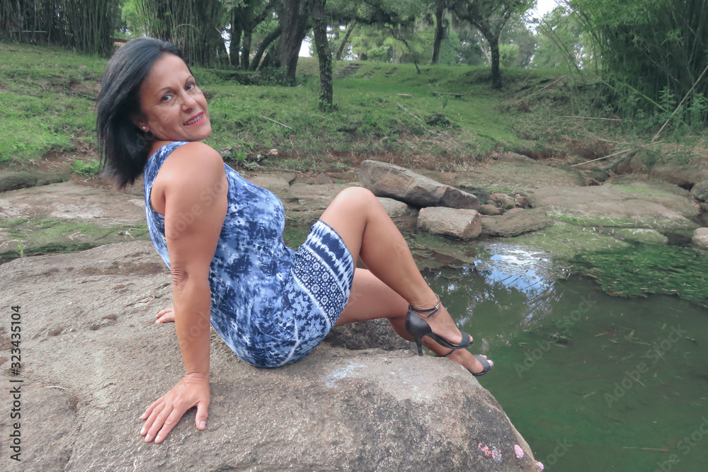 Fototapeta premium Woman on the rock
