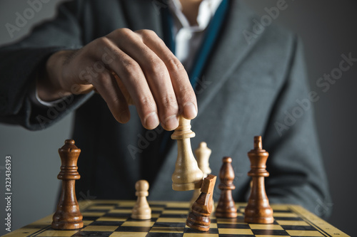 hands confident businessman colleagues playing chess game