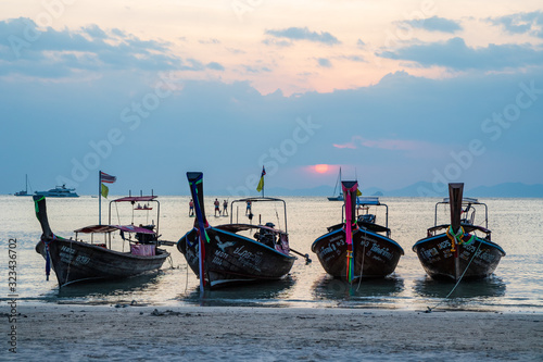 Long tail boats in Koh Lanta Thailand at sunset