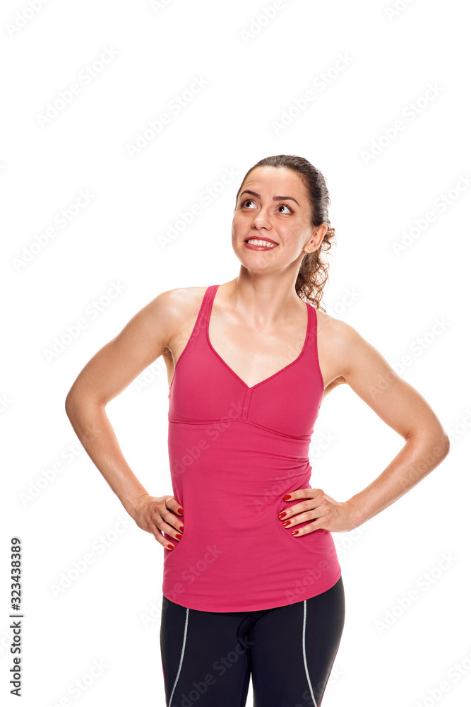 Portrait of slim healthy woman in sportswear posing on white background Portrait of slim healthy woman in sportswear posing on white background