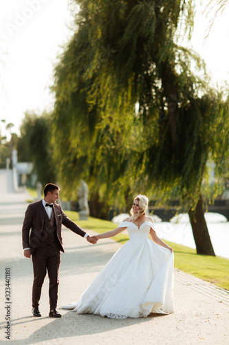 Bride and groom in forest on their wedding, photo session.