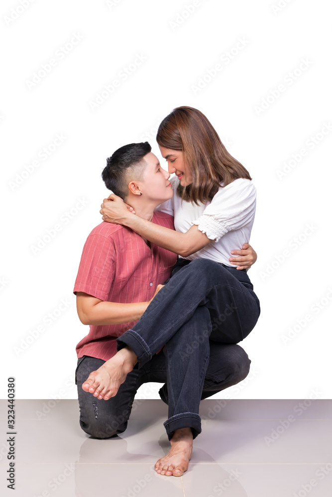woman young girls smiling and happiness sitting on knee of tomboy has tile floor with white background woman young girls smiling and happiness sitting on knee of tomboy has tile floor with white background