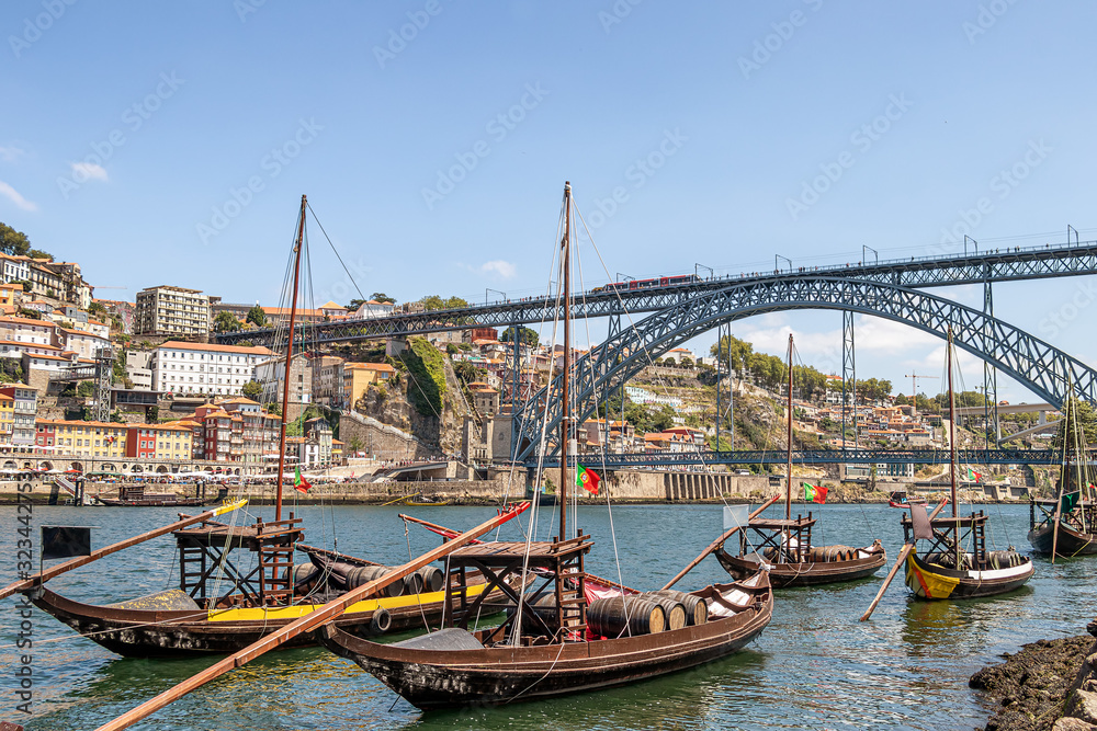 Old traditional boats with wine barrels in Porto, Portugal