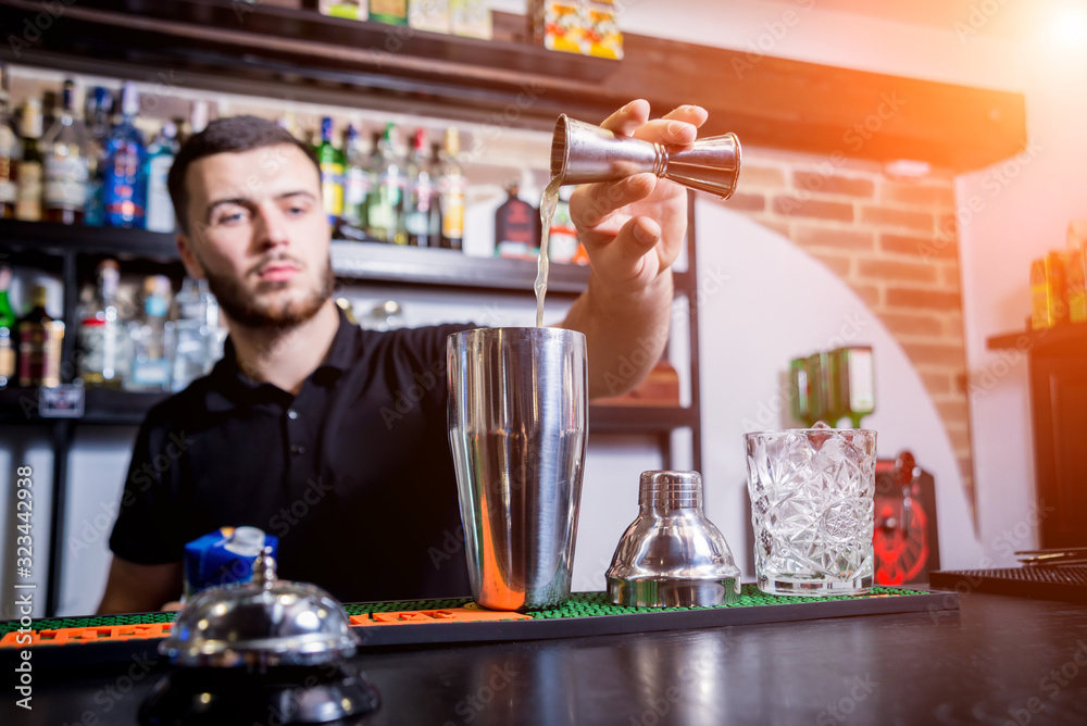 Bartender is making non alcoholic cocktail at bar counter. Bartender is making non alcoholic cocktail at bar counter.