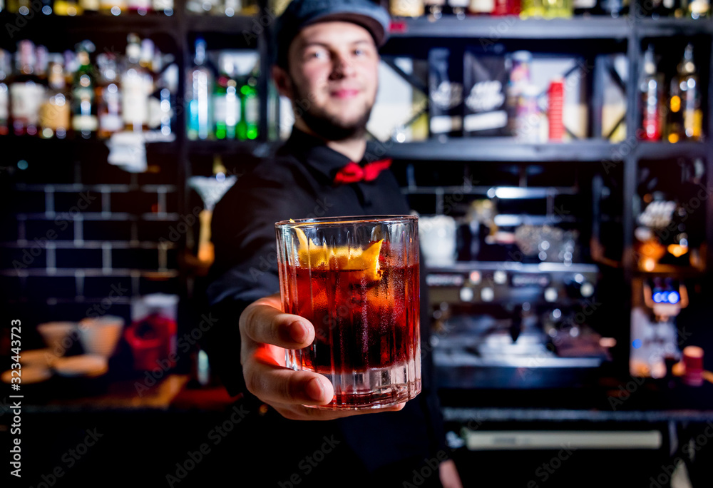 Bartender is making cocktail at bar counter. Fresh cocktails. 