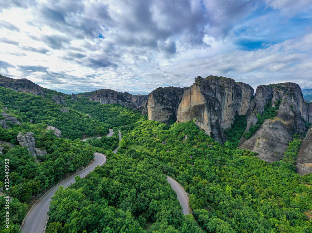 Legendary aerial drone view of ancient monasteries and breathtaking picturesque valley and landmark canyon of Meteora, Greece