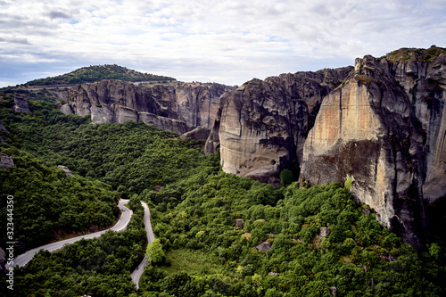 Legendary aerial drone view of ancient monasteries and breathtaking picturesque valley and landmark canyon of Meteora, Greece, Unesco