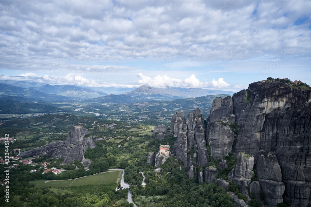 Fototapeta premium Legendary aerial drone view of ancient monasteries and breathtaking picturesque valley and landmark canyon of Meteora, Greece, Unesco