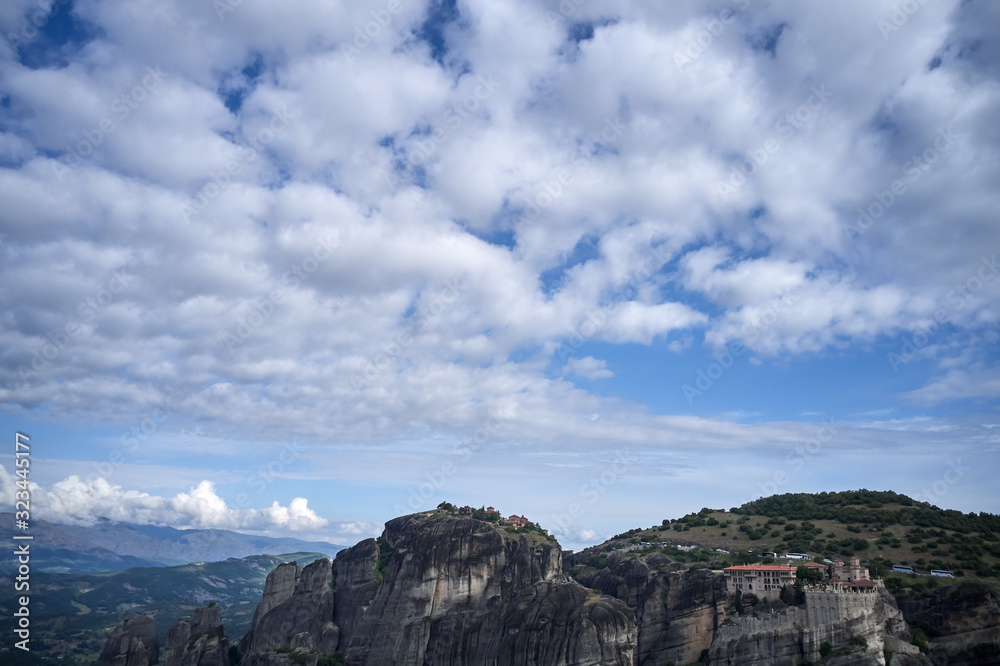 Legendary aerial drone view of ancient monasteries and breathtaking picturesque valley and landmark canyon of Meteora, Greece, Unesco