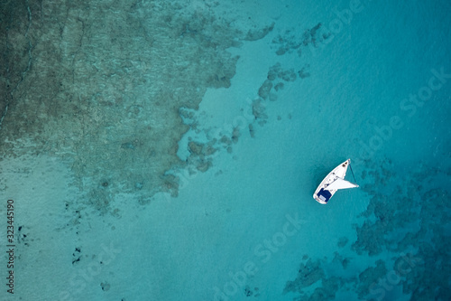 Aerial drone photo of luxury sail boat cruising in the deep blue mediterranean sea, Crete Greece © Mindaugas