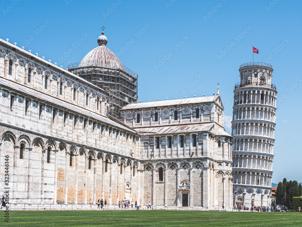 View of the tourists in front of the Pisa tower and the Pisa Cathedral