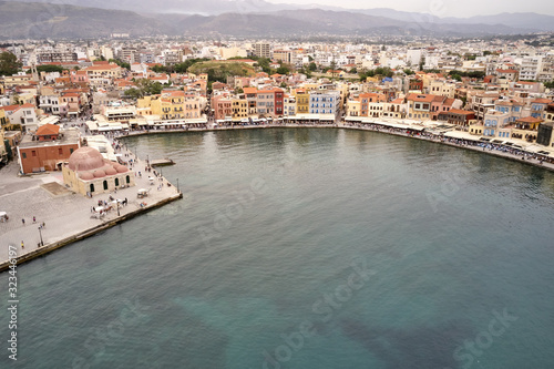 Panoramic drone aerial view from above of the city of Chania, Crete island, Greece. Landmarks of Greece, beautiful venetian town Chania in Crete island. Chania, Crete, Greece. © Mindaugas