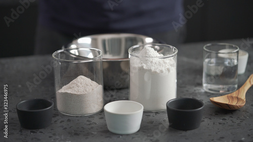 dry ingredients with flour in steel bowl on concrete countertop