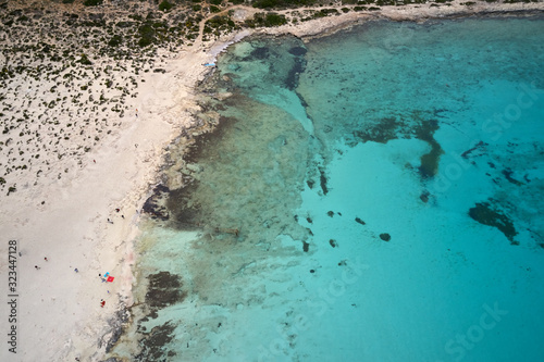 Amazing aerial drone top panoramic view on the famous Balos beach in Balos lagoon and pirate island Gramvousa. Place of the confluence of three seas. Balos beach, Chania. Crete island. Greece. Europe.