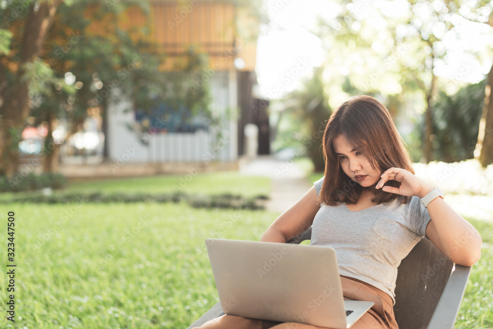 Asian freelance girl working with a laptop. Asian freelance girl working with a laptop.