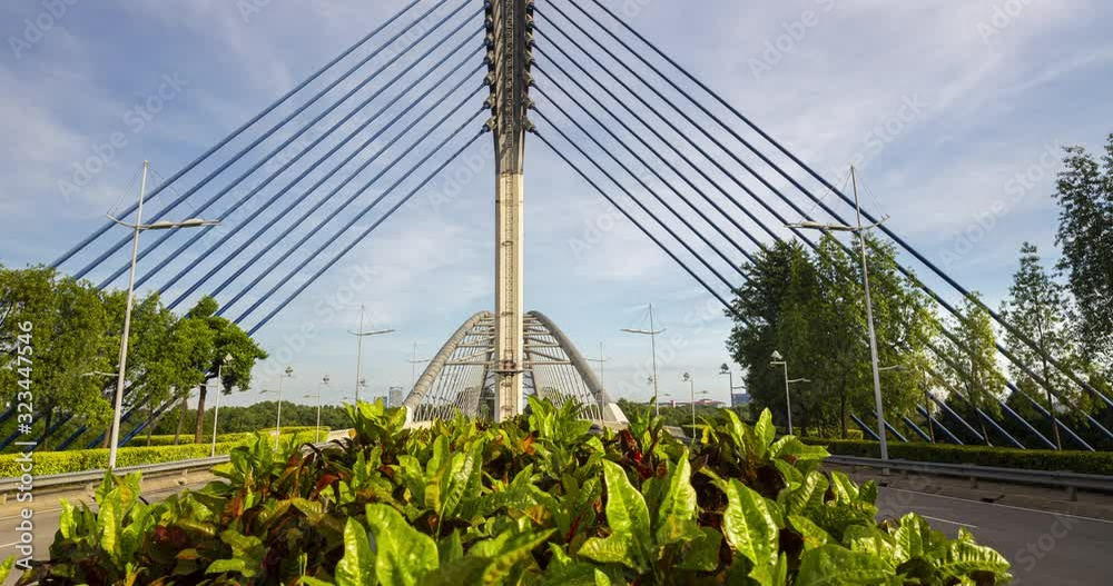 Time lapse of the Seri Saujana Bridge in Putrajaya, Malaysia the Malaysian  Government city 40 km outside of Kuala Lumpur. Pan Tilt time lapse of the cable stayed bridge from the middle of the road