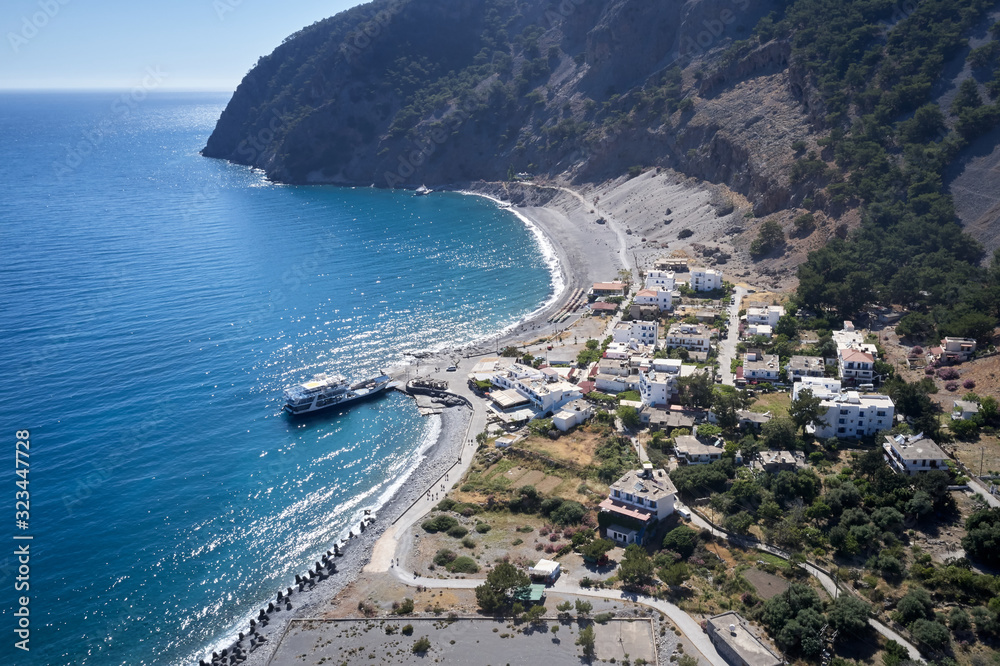 Aerial drone view of Agia Roumeli beach in Chania of Crete, Greece. The village of Agia Roumeli is located at the entrance of the gorge Samaria