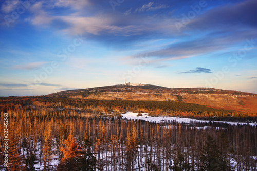 Beautiful light in the February sky at sunset. Scenic Harz mountains in Lower Saxony, Saxony-Anhalt, Germany. Mount Brocken, Harz Germany.