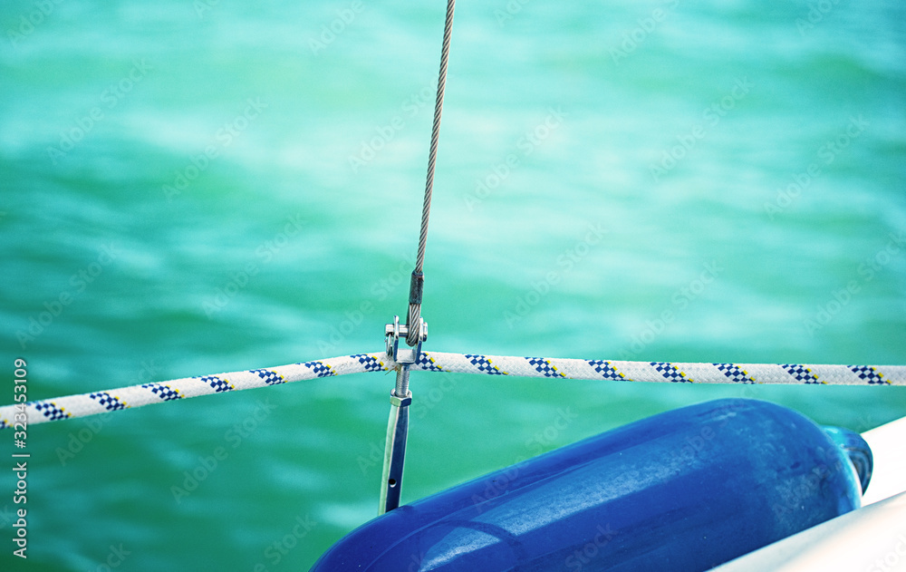 Blue rubber fender protecting the boat Blue rubber fender protecting the boat