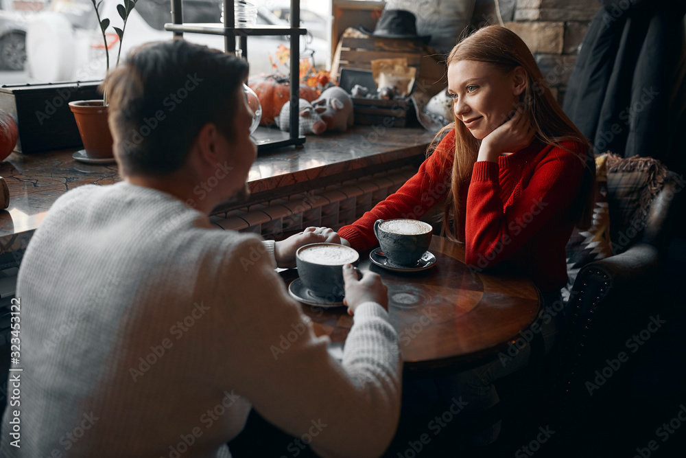 beautiful blonde woman having a date with her boyfriend, they are holding hands and enjoying romantic evening at the restaurant. weekend . tenderness beautiful blonde woman having a date with her boyfriend, they are holding hands and enjoying romantic evening at the restaurant. weekend . tenderness