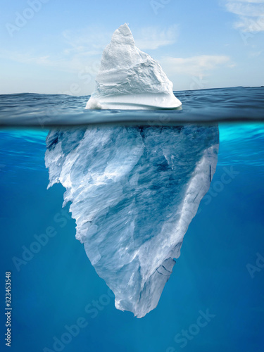 Tip of an Iceberg floating in the water photo