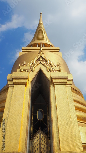 Thailand Beautiful Golden Pagoda with blue sky background at Wat Pra Kaew (Temple of the Emerald Buddha).