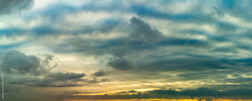 Fantastic dark thunderclouds at sunrise