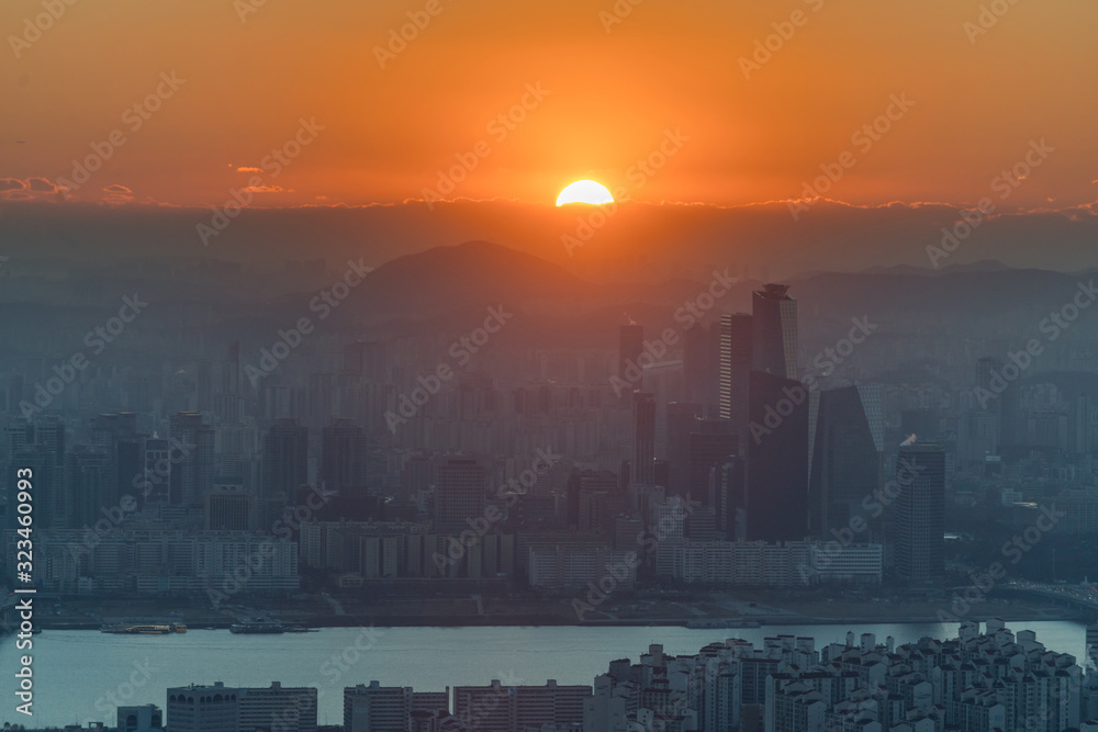 Sunset over Seoul city skyline.