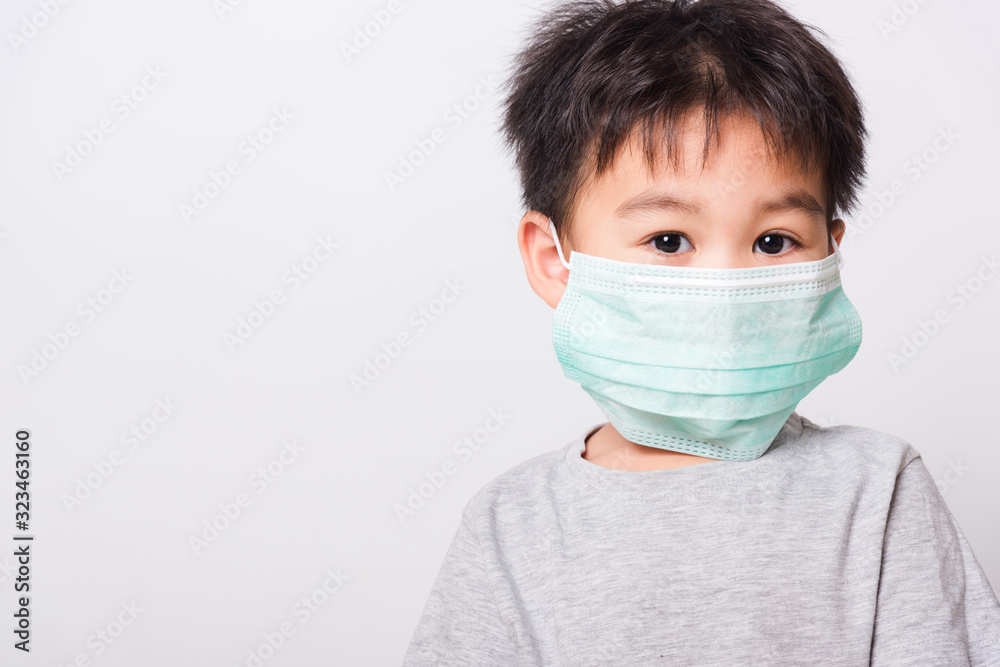 Closeup Asian face, Little children boy sick he using medicine healthcare mask Closeup Asian face, Little children boy sick he using medicine healthcare mask