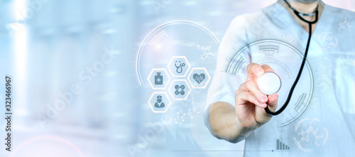 Medicine doctor and stethoscope in hand touching icon medical network connection with modern virtual screen interface, medical technology network concept