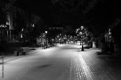 Dark alley and light trails in Hanover, Pennsylvania at night. © Oleksandr