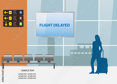 Flight delayed air travel concept showing silhouette of young woman waiting in airport interior. 