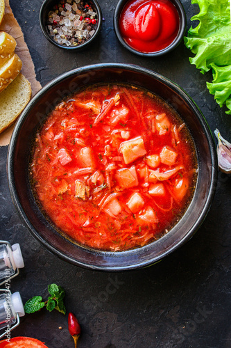borsch, red tomato soup and vegetables and meat (Russian or Ukrainian cuisine) menu concept background. top view. copy space