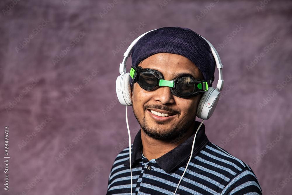 young man with headset an swimming glas young man with headset an swimming glas