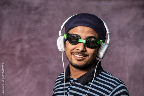 young man with headset an swimming glas
