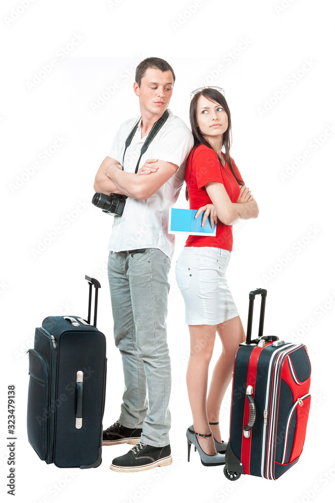 A young man and a woman quarreled while waiting for their flight next to suitcases, isolated on a white background.
